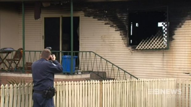 Firefighters investigate a blaze in Gympie that left 12-year-old Alexis Dean in a critical condition. 