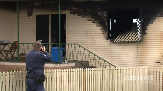Firefighters investigate a blaze in Gympie that left 12-year-old Alexis Dean in a critical condition. 