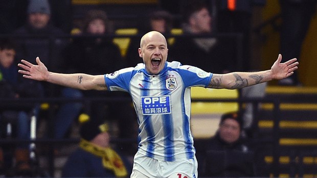 Aaron Mooy celebrates scoring Huddersfield's second goal.