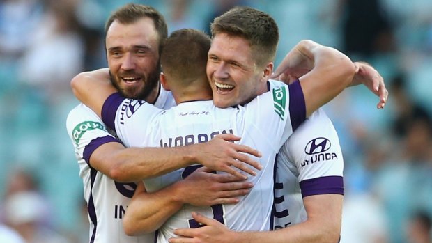 Win to savour: Perth Glory trio Gyorgy Sandor , Marc Warren and Alexander Grant celebrate their victory against Sydney FC on Saturday. 