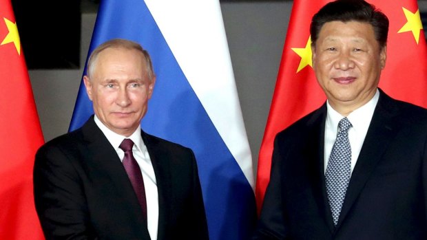 Vladimir Putin with Chinese President Xi Jinping at the BRICS Summit