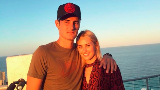 Tomic with his model girlfriend Emma Blake-Hahnel.
