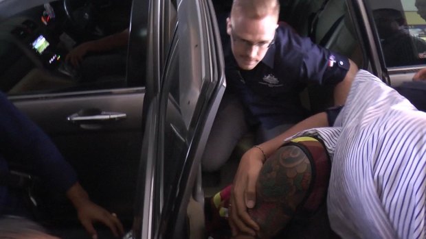 Bali police detain Australian woman Sara Connor over the death of a policeman.