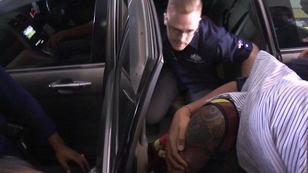 Bali police detain Australian woman Sara Connor over the death of a policeman.