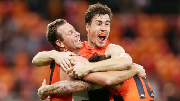 Victory, but at a cost: Steve Johnson (left) celebrates the Giants' miracle win over the Tigers with Jeremy Cameron.