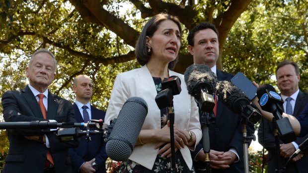 Gladys Berejiklian and Stuart Ayres announce the major stadium developments, flanked by  the heads of the various sporting bodies and trusts involved. 