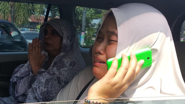 Condemned man Zulfiqar Ali's distraught wife, Siti, after learning her husband will be executed on Thursday night.