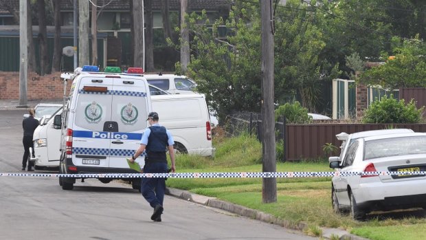 Police have set up a crime scene at the house on Kennedy Street in Guildford.