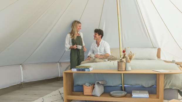 The tent has a full king-sized bed with luxury linen, and a custom-made table and armchair.