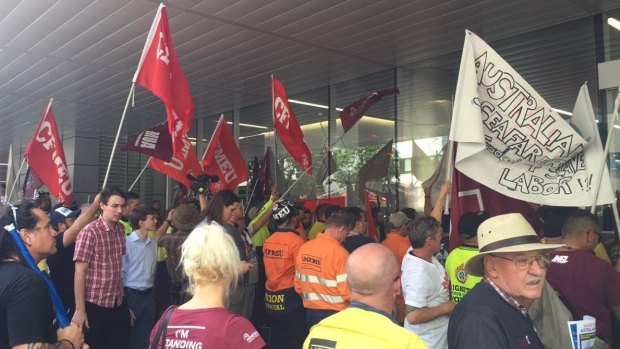 Union members protest the replacement of Australian shipping workers in Albert St, Brisbane.