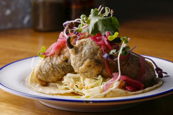 The fish tacos feature beer-battered swordfish-stuffed jalapenos.