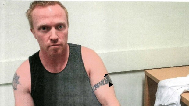 History of violence: Adrian Bayley in police custody after killing Jill Meagher.