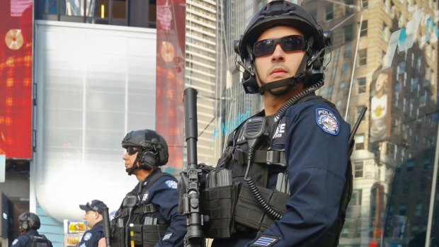 Officers from the NYPD anti-terror unit patrol Times Square.