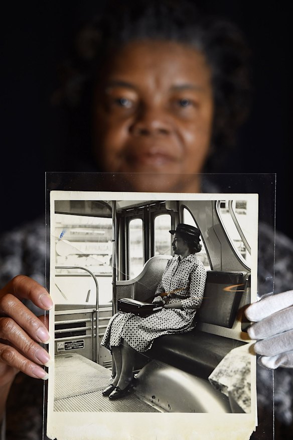 Maricia Battle, curator with the prints and photographs division of the Library of Congress, holds a photo of Rosa Parks from the exhibition.