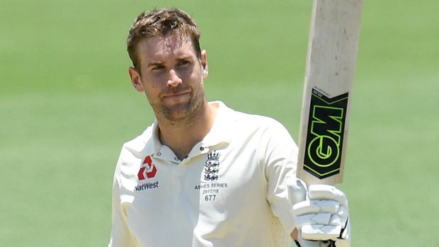 Solid form: England batsman Dawid Malan raises his bat after scoring a century on day three of the tour match between Cricket Australia XI and England.