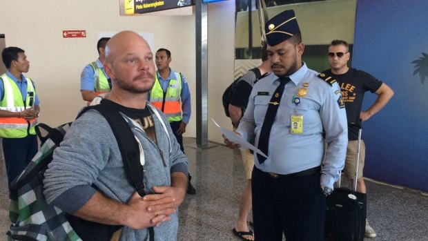 Ricky Longmuir waits to board his flight from Bali to Melbourne.