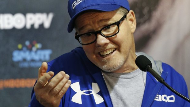 Gloves query: Manny Pacquiao's trainer Freddie Roach speaks to the media.