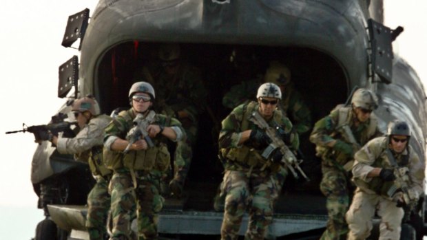 Members of a Navy SEAL team participate in infiltration and exfiltration training at Fort Wainwright, Alaska, in 2009.