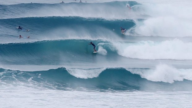 Some surfers are taking on the wild conditions but surf life savers have warned against it. 