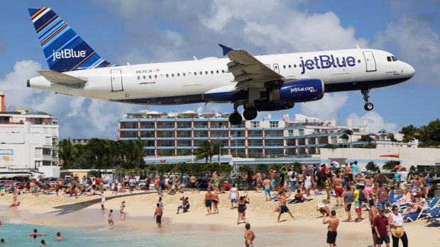 JetBlue flying into St. Maarten, Antilles.