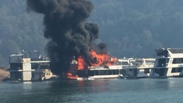 Flames engulf the house boat.