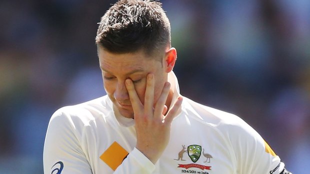 Michael Clarke wipes his eyes as he tears up during an emotional tribute for Phillip Hughes.