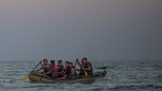 Migrants arrive on the Greek island of Kos on Sunday.  
