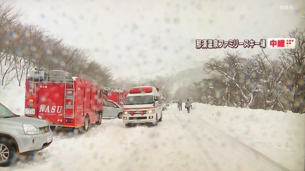 Emergency services vehicles at the scene in Nasu.