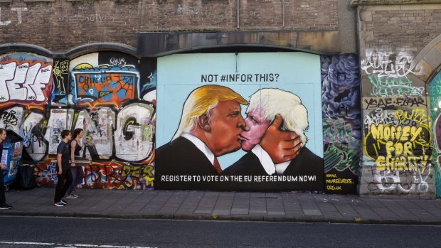A political graffiti mural calling for people to register for the upcoming UK referendum depicts US presidential candidate Donald Trump and former London mayor Boris Johnson kissing.