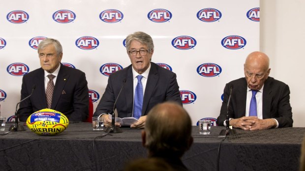 Media heavyweights Kerry Stokes and Rupert Murdoch flank AFL Commission chairman Mike Fitzpatrick at the recent announcement of a $2 billion Foxtel deal.