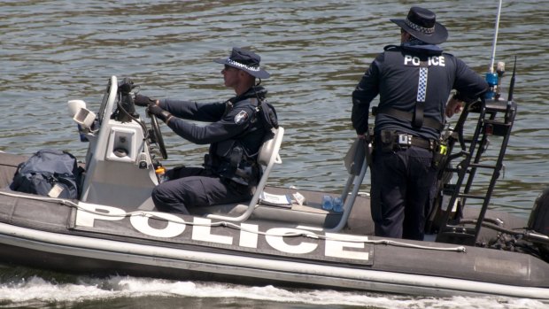 Water police are among the officers searching the Brisbane River at Hamilton for a swimmer thought to be in trouble.
