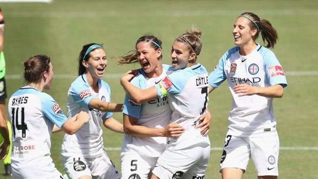 Laura Alleway and Melbourne United celebrate after scoring a goal in round 2 against Canberra United.