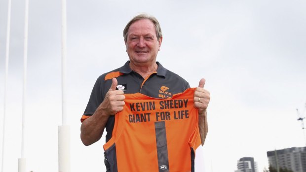 Life member: Kevin Sheedy poses with his Giants jumper on Tuesday.