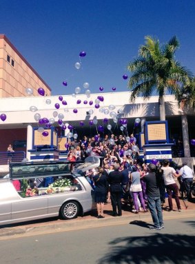 Blue and purple balloons were released after Crystal Cartledge and her young son Baileigh were farewelled.