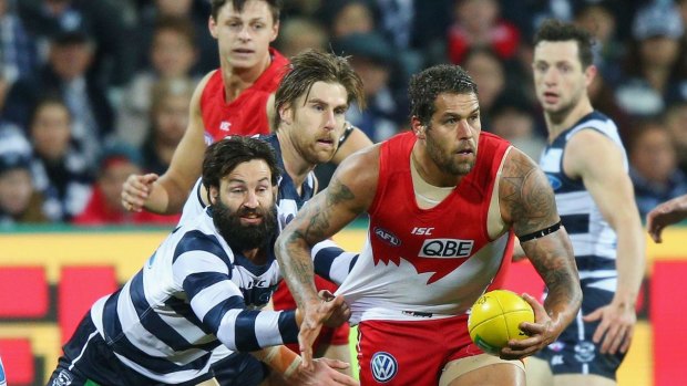 Swans dangerman Lance Franklin stays one step ahead of the Cats' Jimmy Bartel in their round 16 clash. 