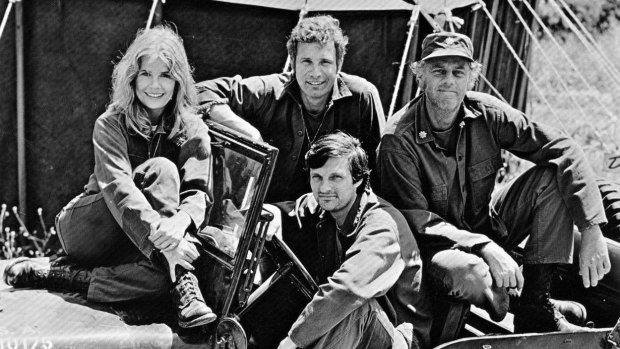 The cast of <i>M*A*S*H</i>, from left: Loretta Swit (Margaret "Hot Lips" Houlihan), Wayne Rogers (Trapper John), McLean Stevenson (Henry Blake) and Alan Alda (Hawkeye Pierce) in the driver's seat.