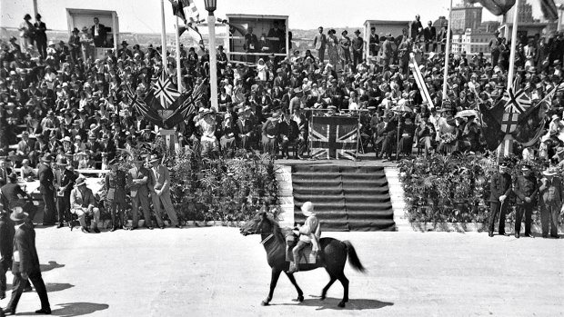 Lennie Gwyther, nine, on his pony Ginger Mick, passing the official dais at the opening of the Sydney Harbour Bridge, 1932.