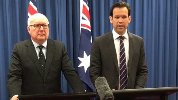 Former federal resources minister Matt Canavan (right) announces he has quit cabinet amid doubts about his citizenship on Tuesday.