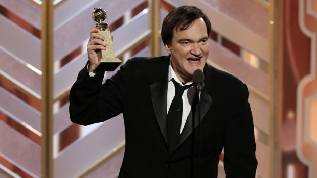 Director Quentin Tarantino accepts a Golden Globe Award for The Hateful Eight in January 2016.