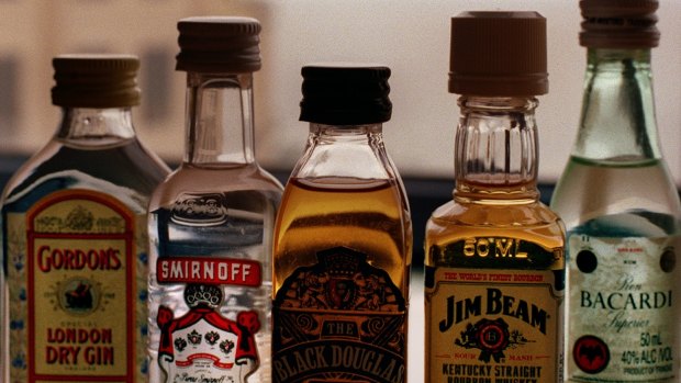 Two cabin staff were fired over after the random search, which uncovered single-serve bottles of spirits. 