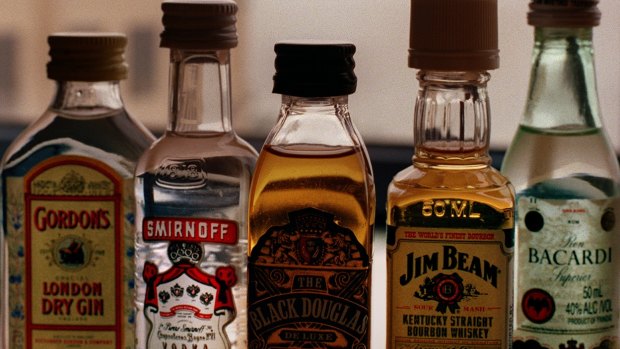 Two cabin staff were fired over after the random search, which uncovered single-serve bottles of spirits. 