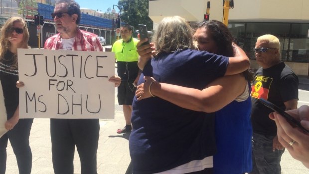 Ms Dhu's grandmother Carol Roe hugging a friend outside court.