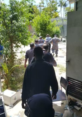 A photo appearing to show the arrest of refugee Behrouz Boochani at the camp on Thursday.