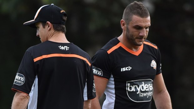 We good? Robbie Farah, right, and coach Jason Taylor crossing paths at a training session. 