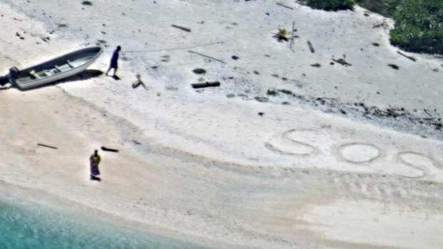 An 'SOS' message in the sand saved two men stranded on a remote island.