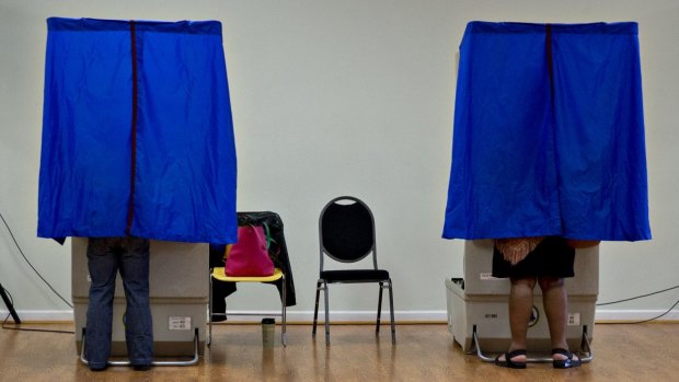 Residents use an electronic voting machine at a polling location in Philadelphia, Pennsylvania.