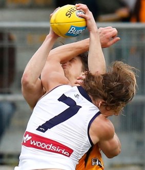 Nat Fyfe collides with Taylor Duryea during Sunday's match.