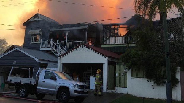 Fire has destroyed two Queenslander houses at Paddington on Sunday morning.