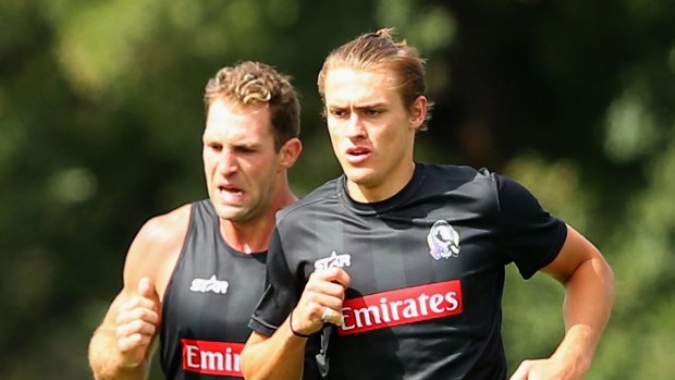 Room to co-exist? Travis Cloke and Darcy Moore.