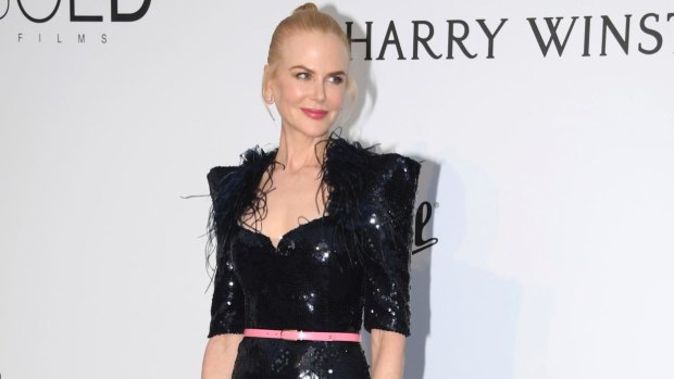 Actress Nicole Kidman poses for photographers upon arrival at the amfAR charity gala.